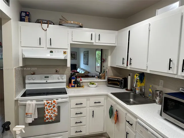 a view of a hallway with paintings on the wall
