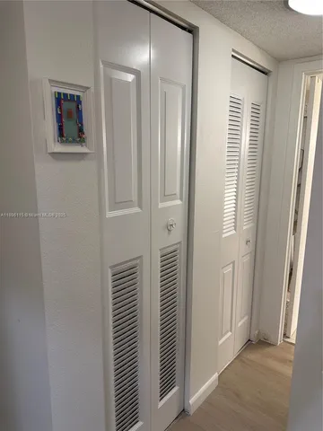 a view of a bathroom from a hallway