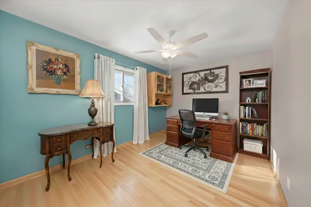 a workspace with furniture and a window