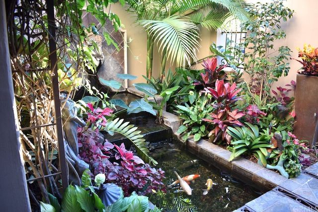 a living room with furniture and a lamp