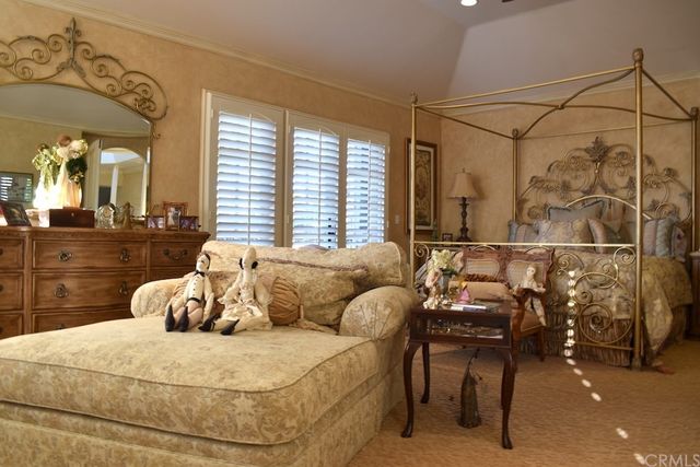 a bedroom with furniture and a window