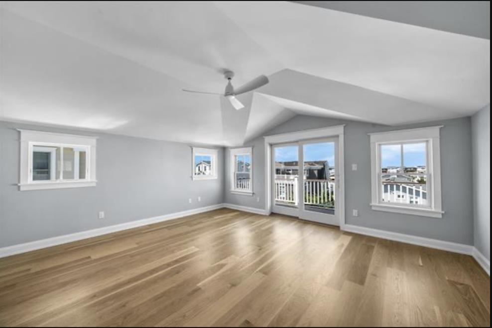 174 23rd Street Avalon, NJ 08202 - Photo 11 of 15 a view of an empty room with a window and wooden floor