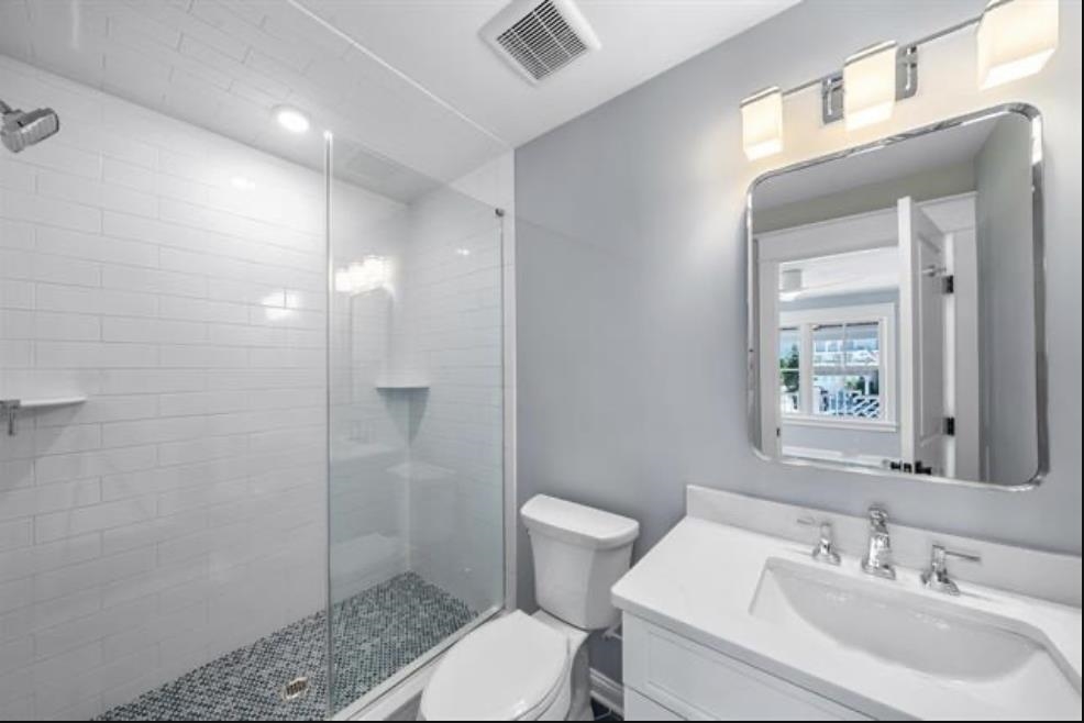 174 23rd Street Avalon, NJ 08202 - Photo 14 of 15 a bathroom with a sink toilet and shower