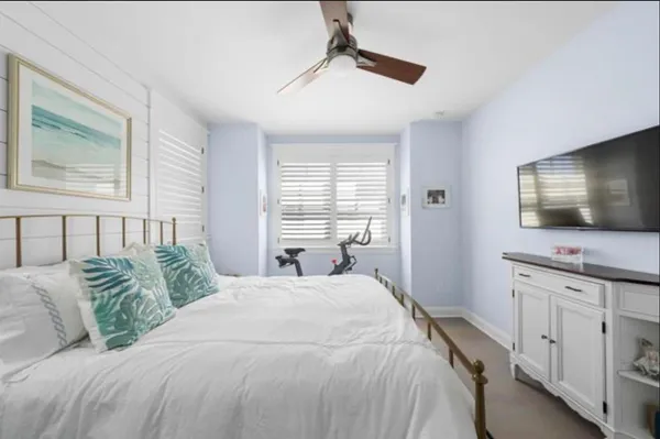 a bed room with a bed and a window
