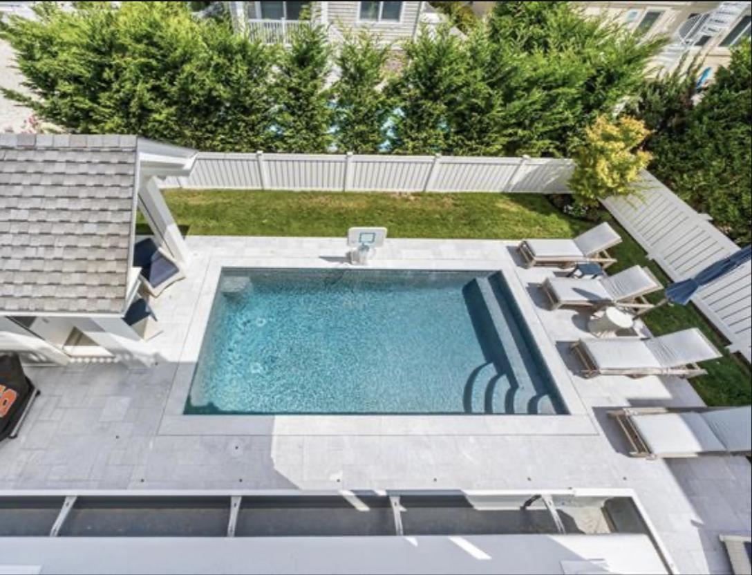 174 23rd Street Avalon, NJ 08202 - Photo 23 of 23 a view of a swimming pool with a yard