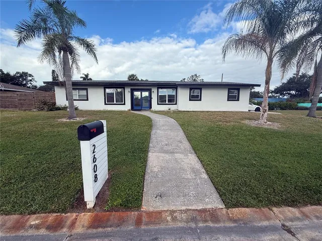 front view of a house with a yard