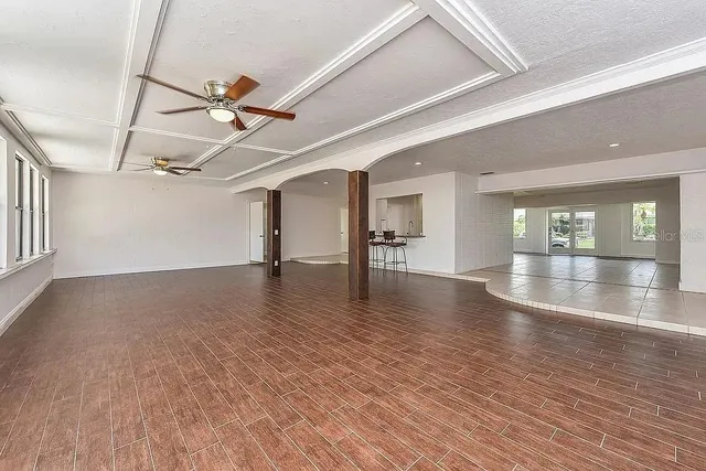 a view of a room with wooden floor