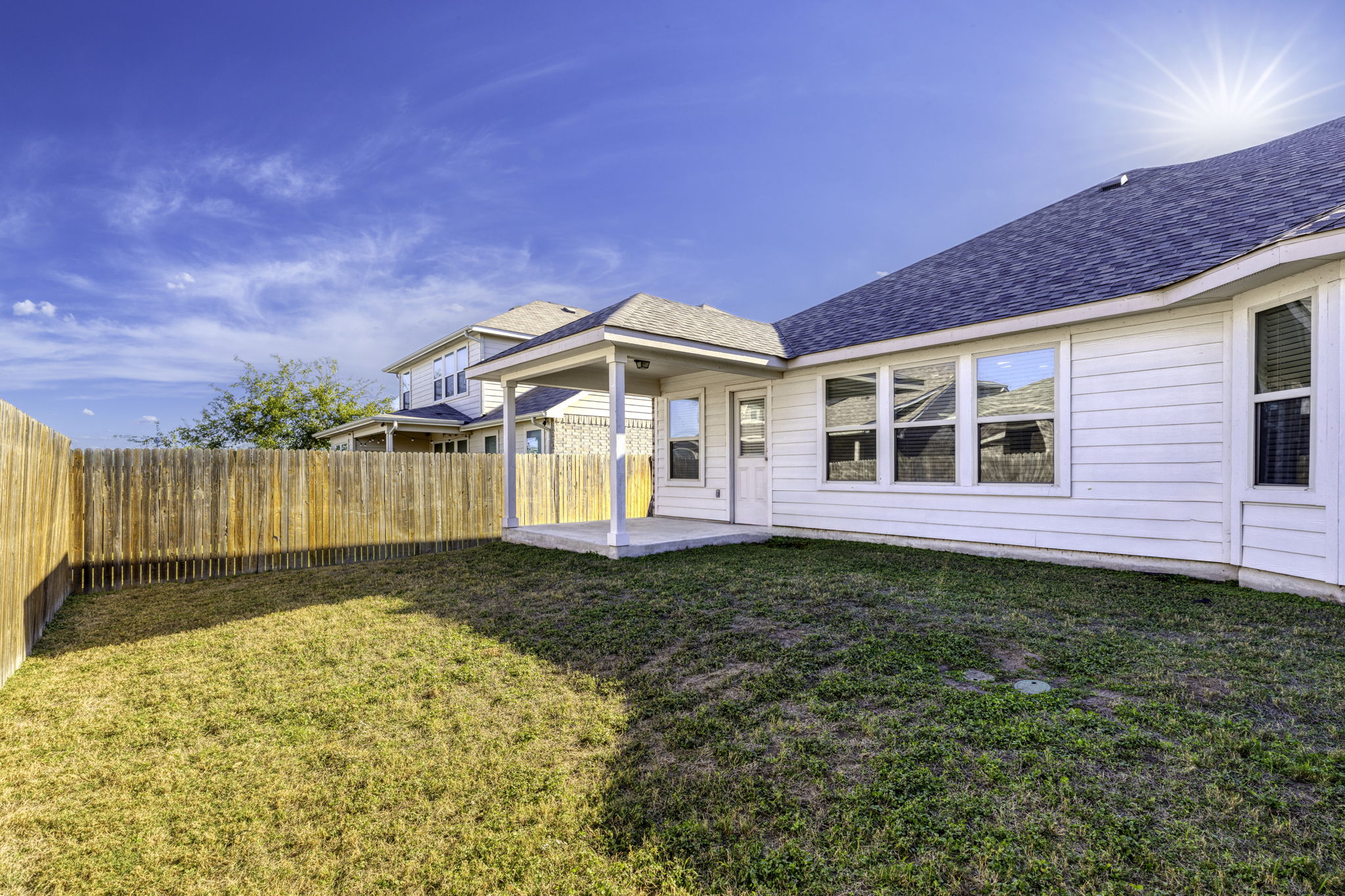 3116 Bragg Place Pflugerville, TX 78660 - Photo 26 of 29 a view of a house with a wooden fence