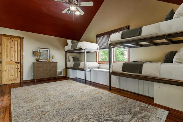 a living room with furniture and chandelier