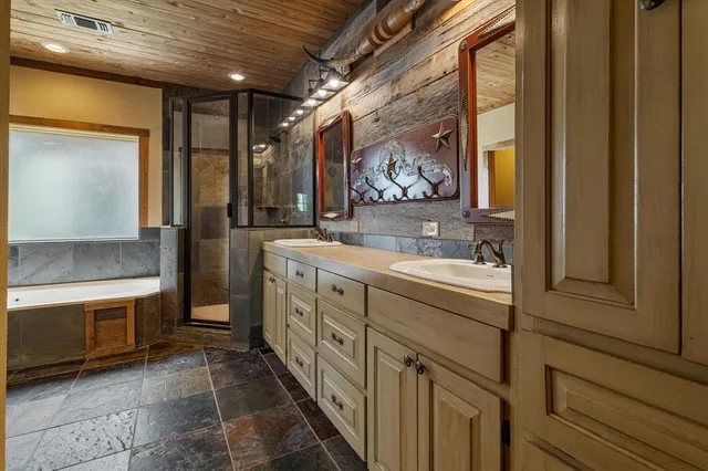 a bathroom with a sink a vanity and a mirror
