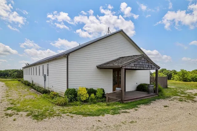 a view of a house with wooden walls