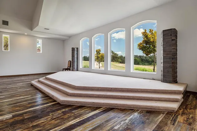 a bedroom with bed and a window