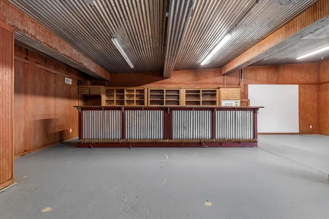 a view of a porch with wooden fence