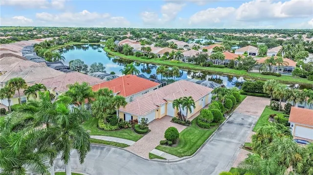 an aerial view of residential houses with outdoor space and street view
