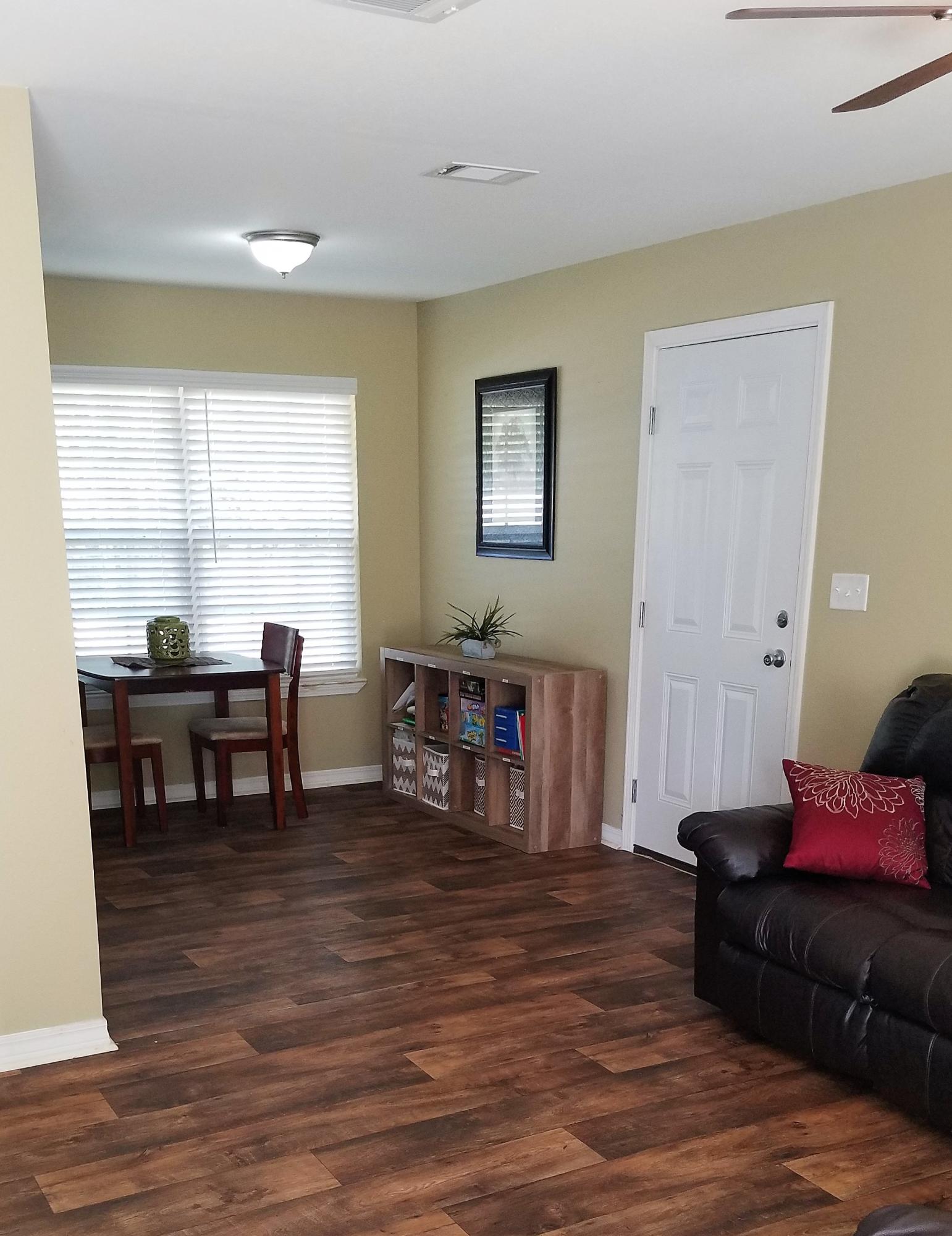 3111 Auburn Road Crestview, FL 32539 - Photo 3 of 16 a living room with furniture and large windows