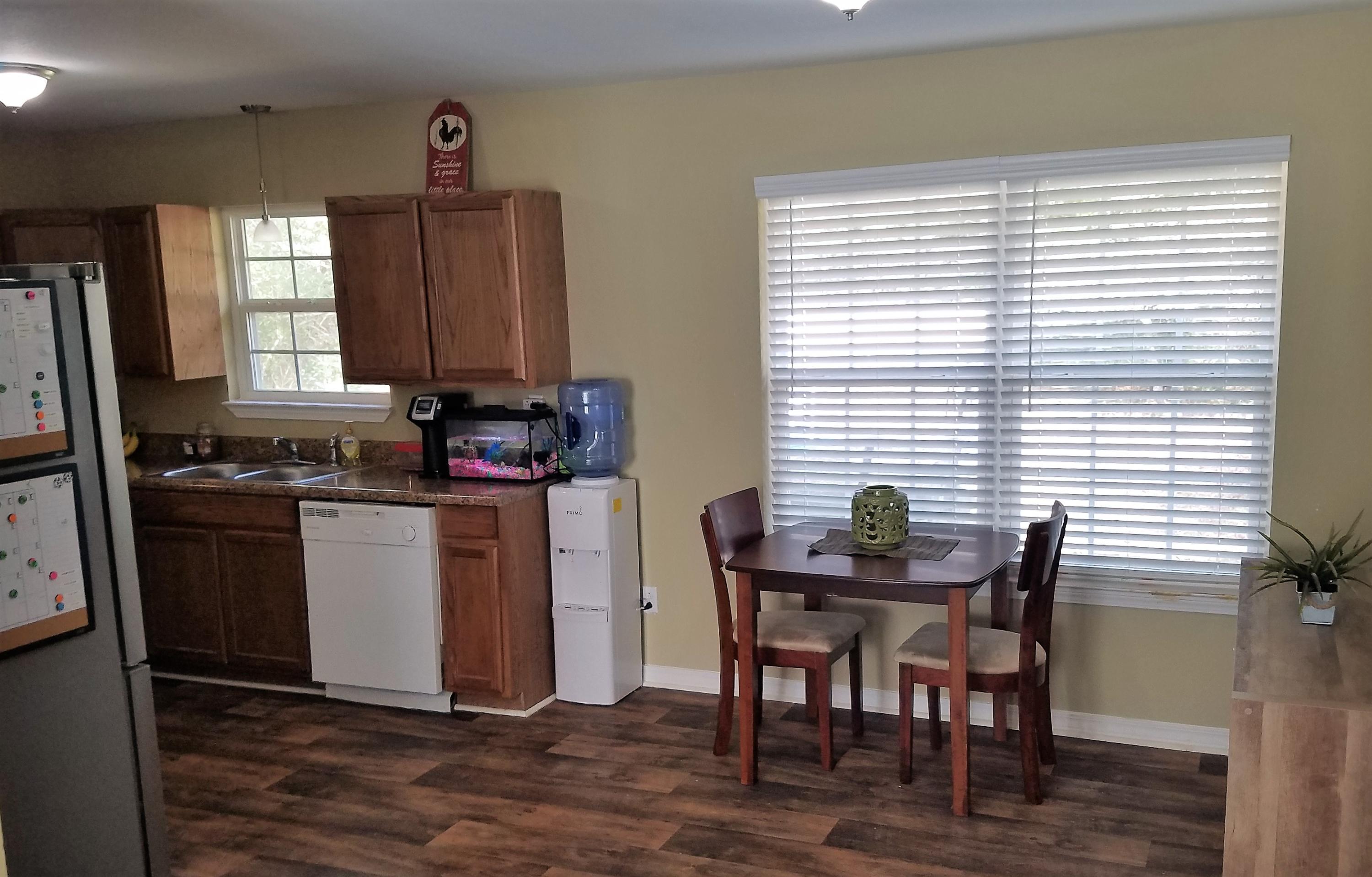 3111 Auburn Road Crestview, FL 32539 - Photo 4 of 16 a dining room with furniture and window