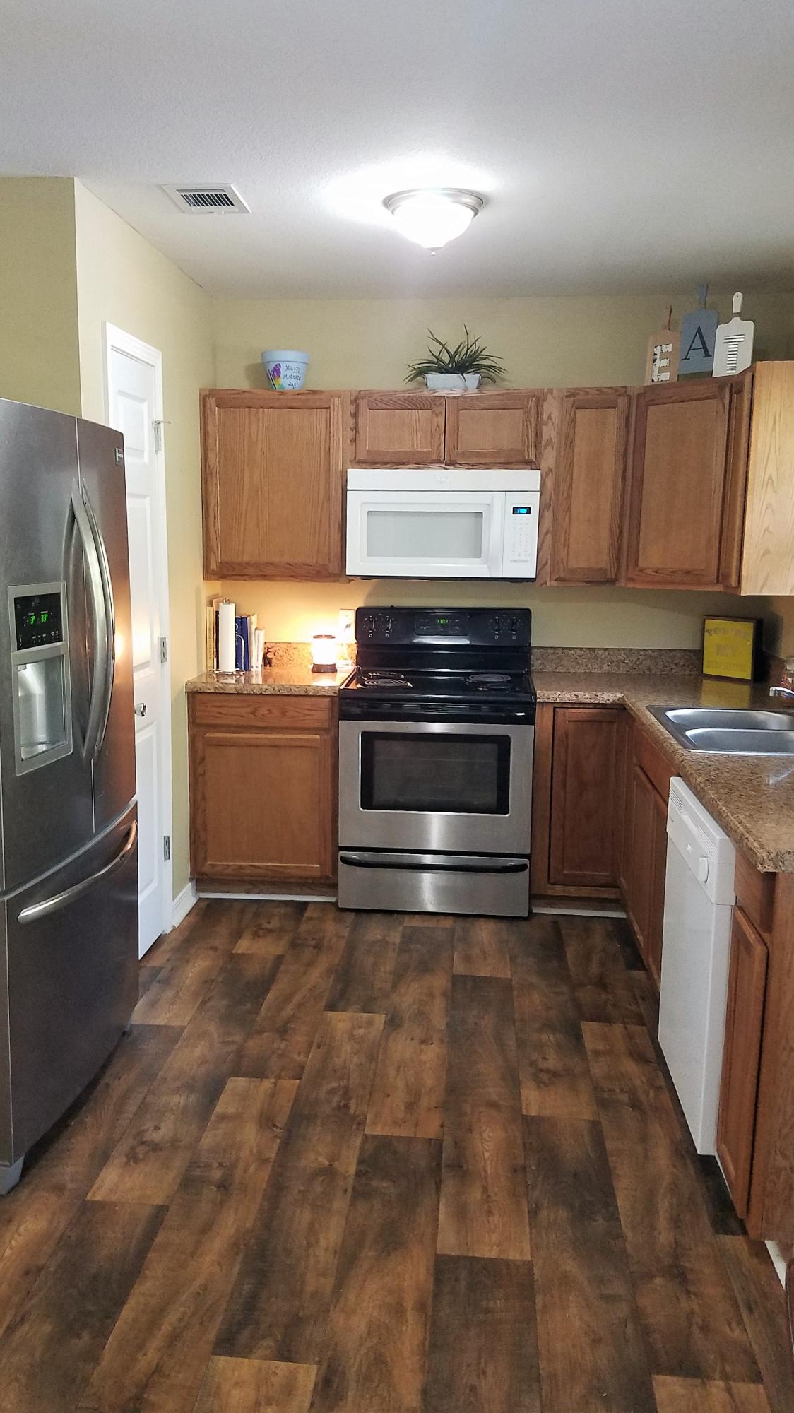 3111 Auburn Road Crestview, FL 32539 - Photo 6 of 16 a kitchen with cabinets and steel stainless steel appliances