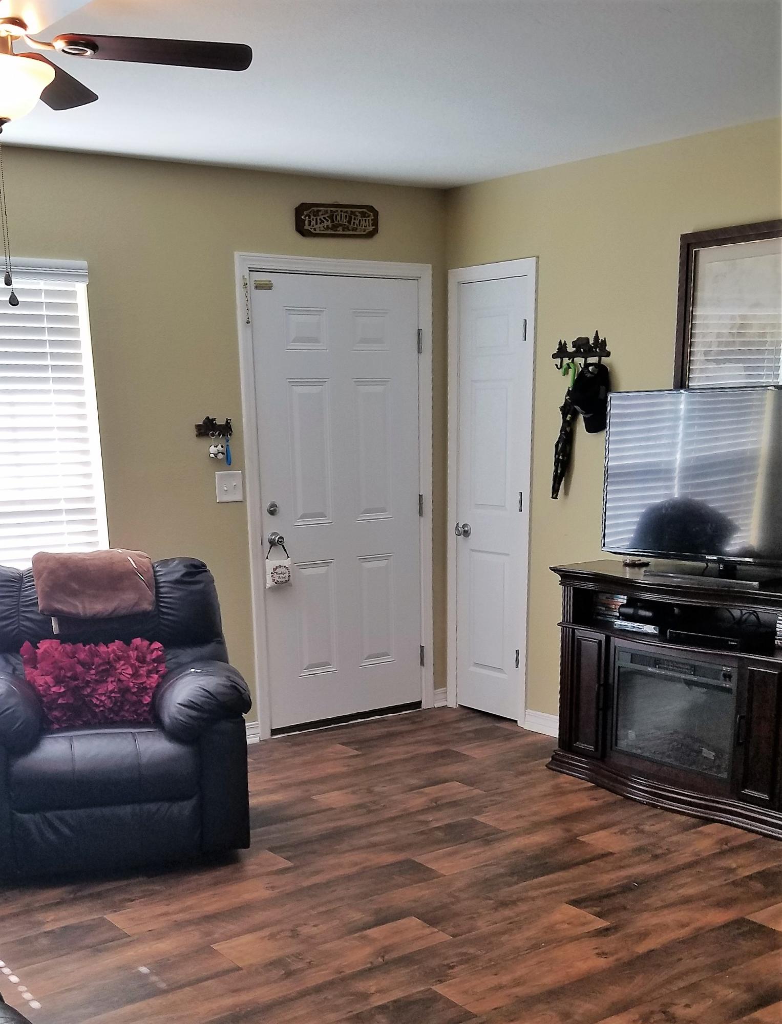 3111 Auburn Road Crestview, FL 32539 - Photo 9 of 16 a living room with furniture and a wooden floor