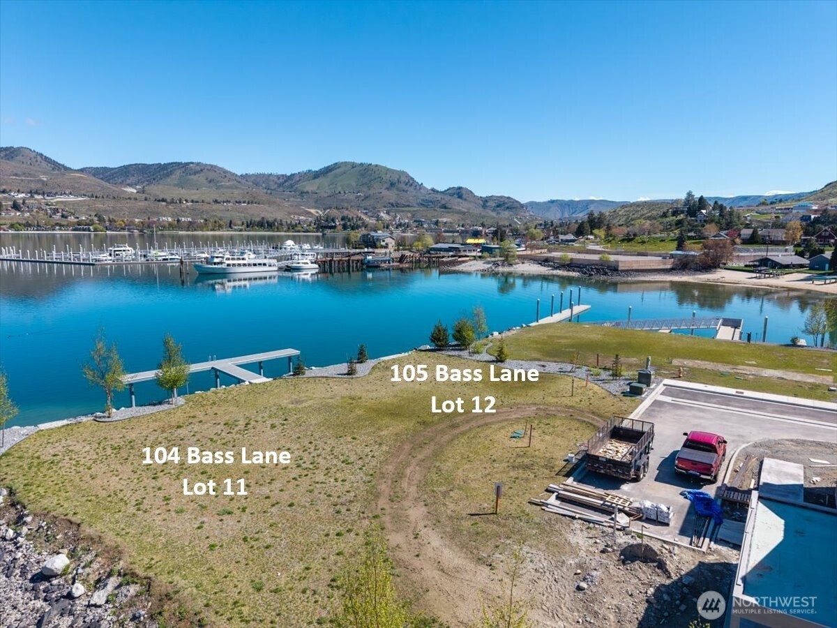 105 Bass Lane Chelan, WA 98816 - Photo 17 of 29 a view of a water pond with mountains in the background