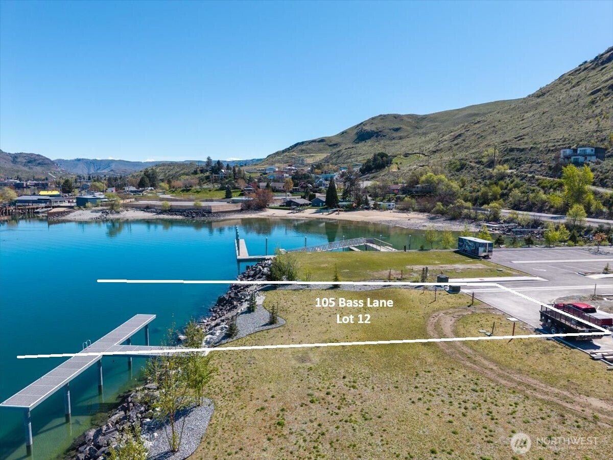 105 Bass Lane Chelan, WA 98816 - Photo 3 of 29 a view of a lake with a mountain in the background