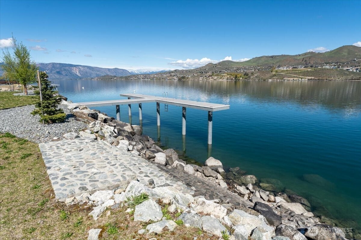 105 Bass Lane Chelan, WA 98816 - Photo 7 of 29 a view of a lake with a mountain in the background