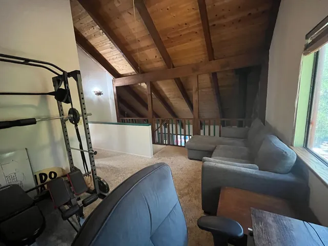 a bathroom with a sink a toilet a mirror and shower curtain