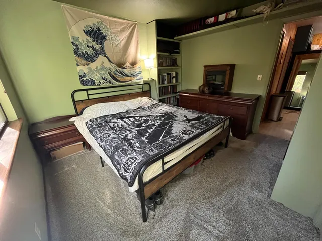 a view of a blue and trees in the middle of a yard