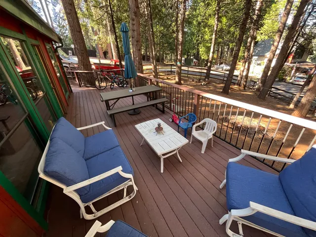 a view of a backyard with large trees