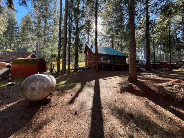 a view of a small barn with wooden door