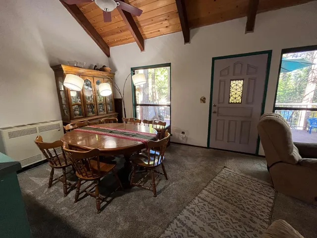 a dining room with furniture and window