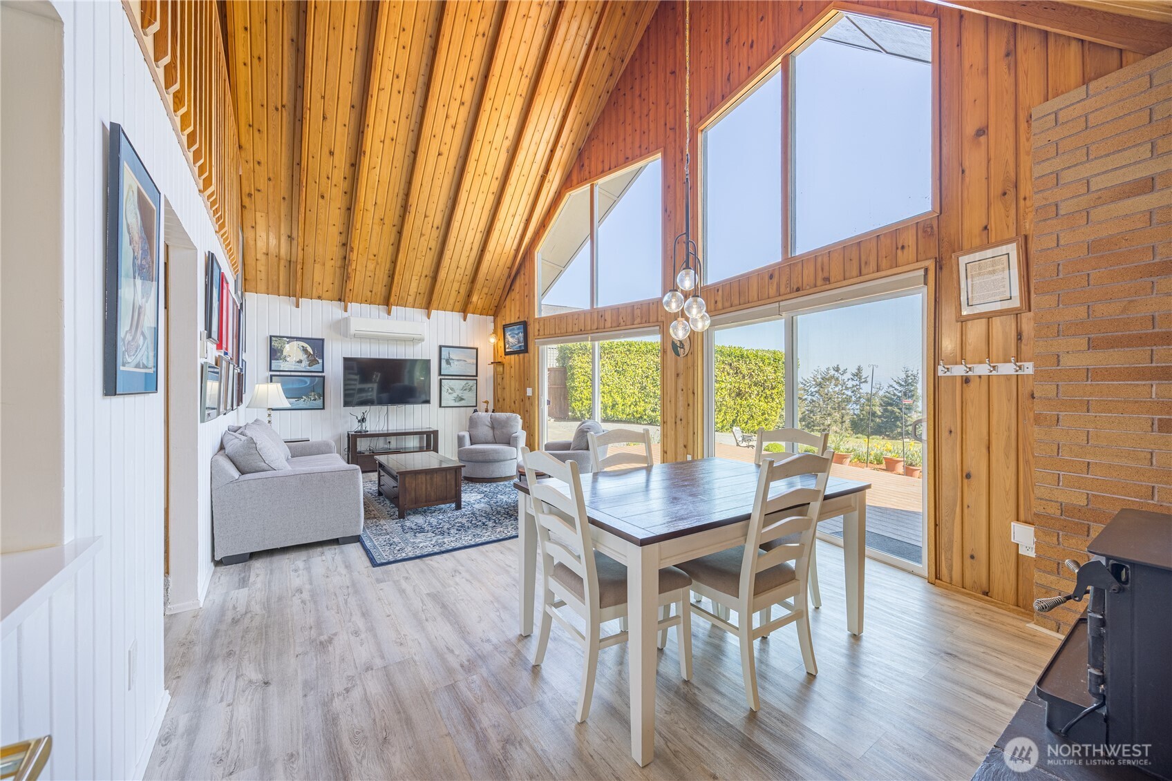 382 Discovery Way Sequim, WA 98382 - Photo 12 of 40 a living room with furniture a wooden floor and a large window