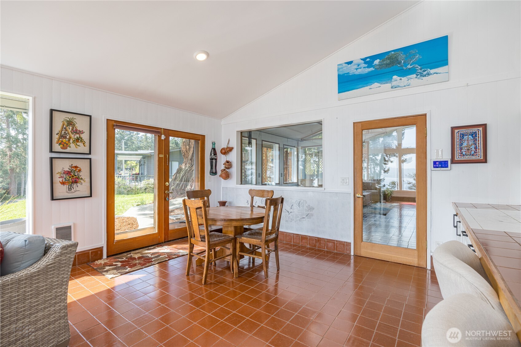 382 Discovery Way Sequim, WA 98382 - Photo 20 of 40 a dining room with wooden floor and a floor to ceiling window