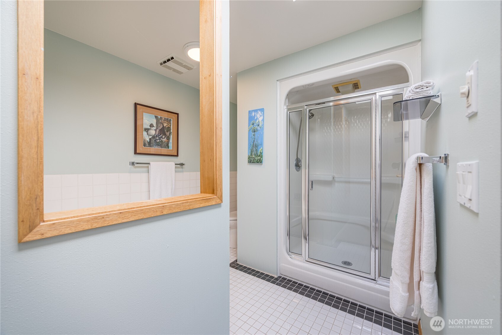 382 Discovery Way Sequim, WA 98382 - Photo 30 of 40 a bathroom with a shower and a window