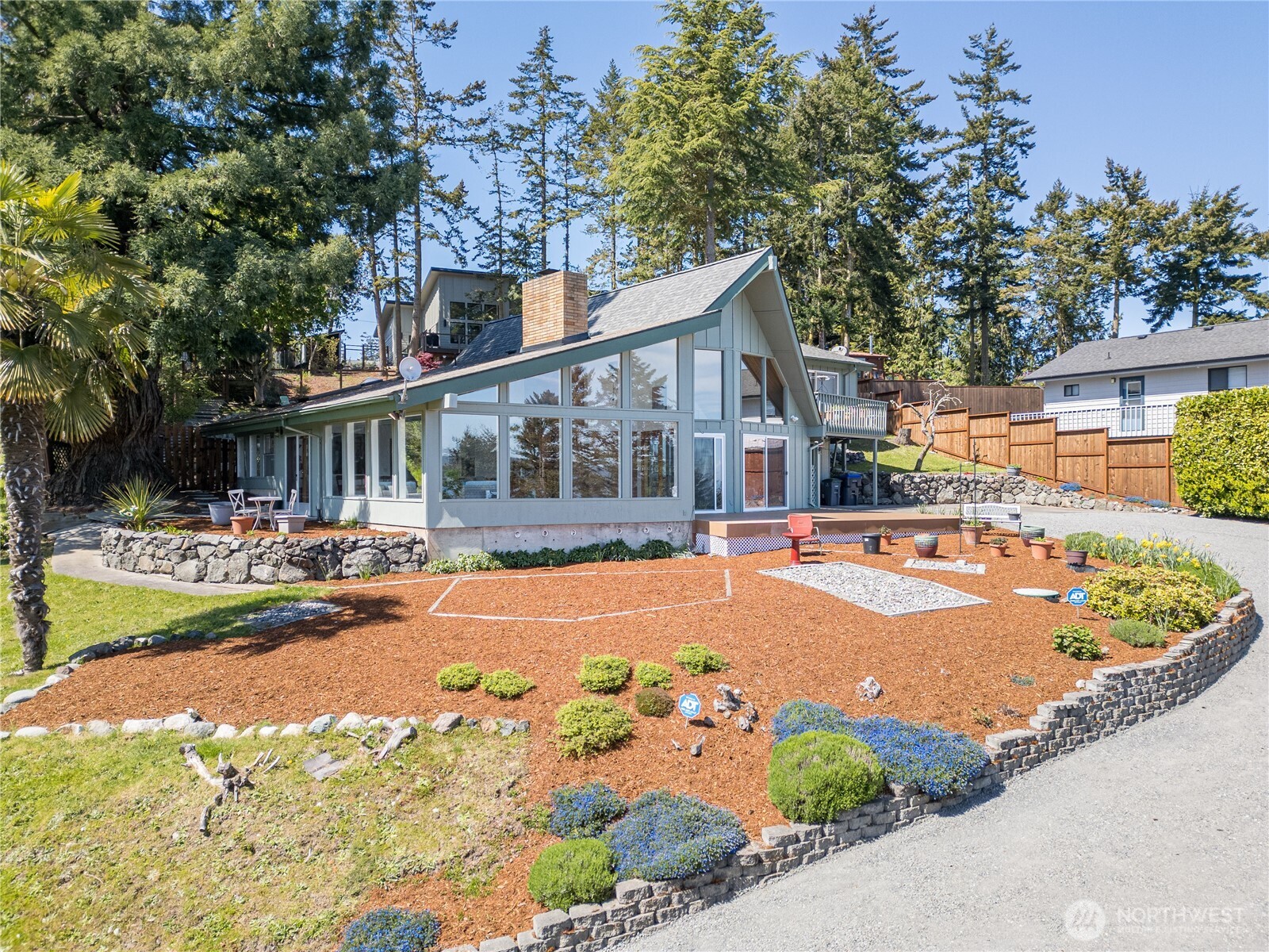 382 Discovery Way Sequim, WA 98382 - Photo 3 of 40 a view of a house with swimming pool and sitting area