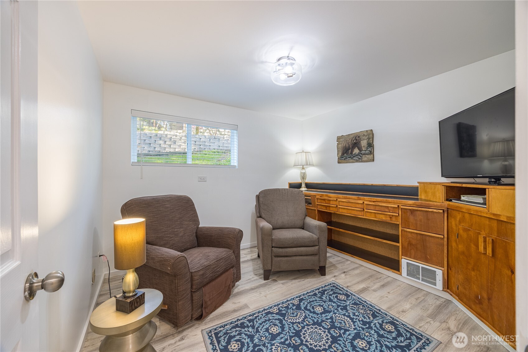 382 Discovery Way Sequim, WA 98382 - Photo 33 of 40 a living room with furniture and a flat screen tv