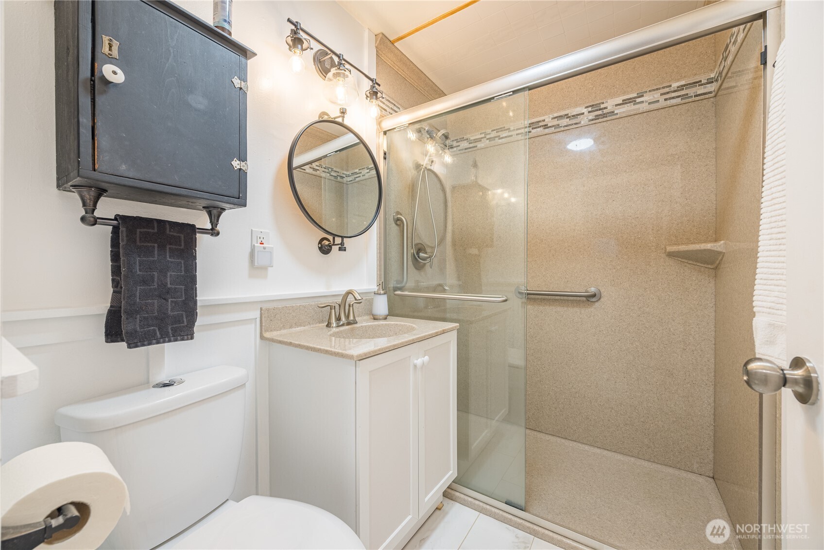 382 Discovery Way Sequim, WA 98382 - Photo 35 of 40 a bathroom with a sink a mirror a toilet and a shower