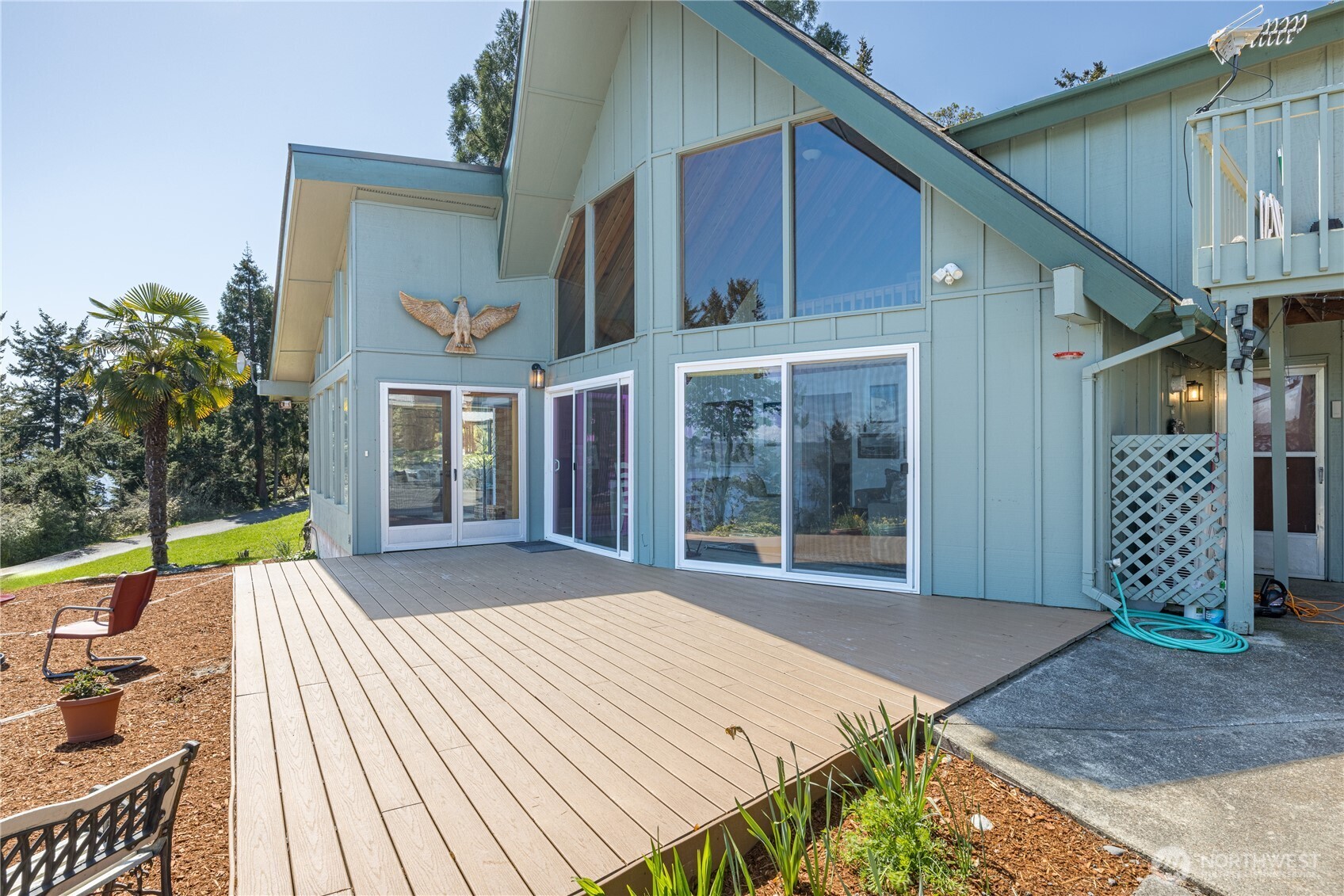 382 Discovery Way Sequim, WA 98382 - Photo 5 of 40 a front view of a house with a garden