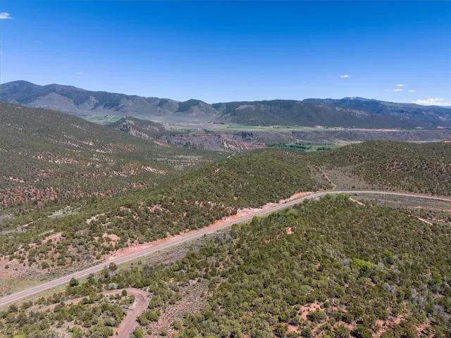a view of a mountain from a yard