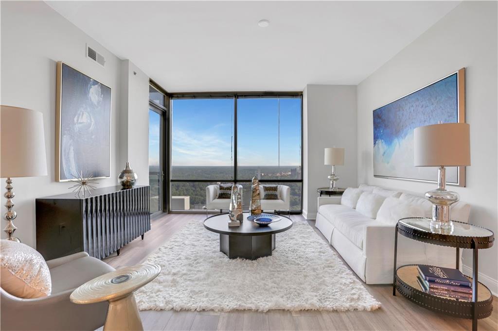 270 17th Street Northwest, Unit 3308 Atlanta, GA 30363 - Photo 11 of 49 a living room with furniture a window and a lamp