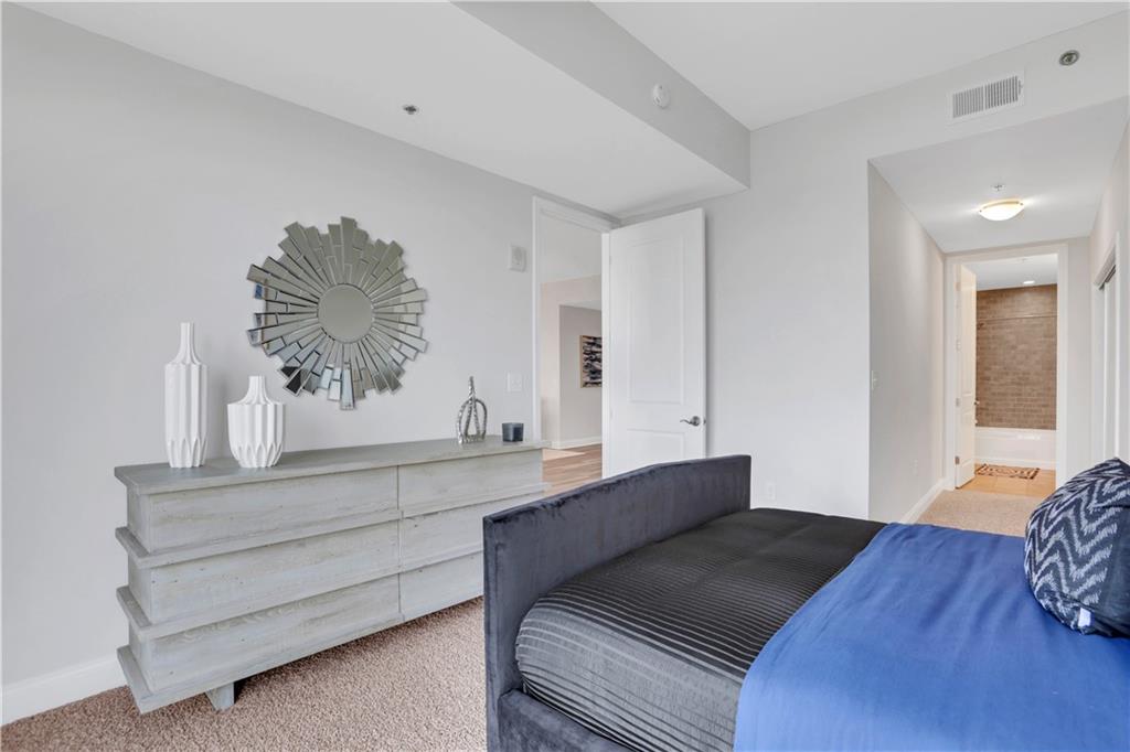 270 17th Street Northwest, Unit 3308 Atlanta, GA 30363 - Photo 13 of 49 a bedroom with a bed and a window