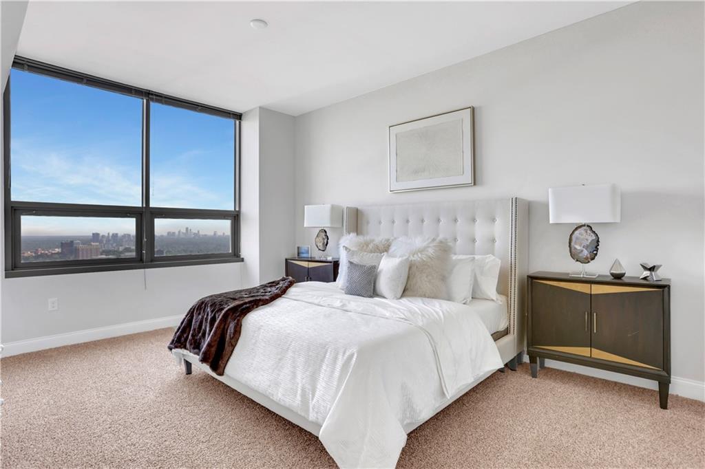 270 17th Street Northwest, Unit 3308 Atlanta, GA 30363 - Photo 19 of 49 a bedroom with a bed and window