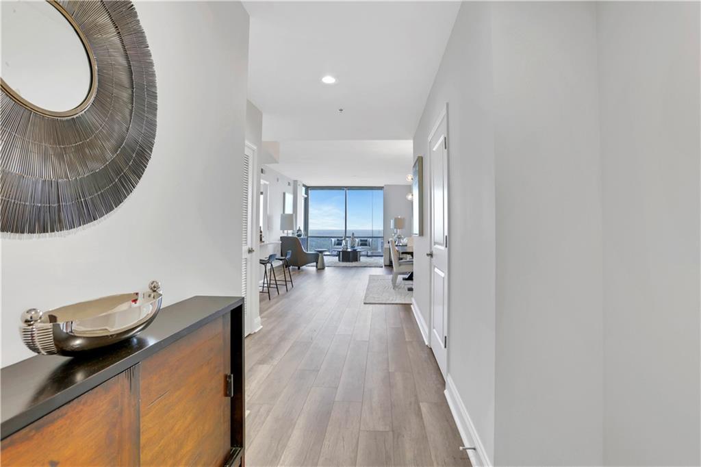 270 17th Street Northwest, Unit 3308 Atlanta, GA 30363 - Photo 2 of 49 a living room with furniture and a wooden floor