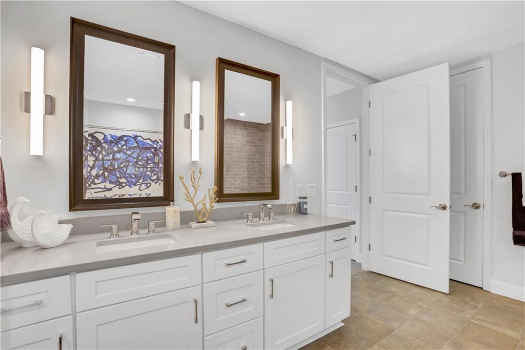 270 17th Street Northwest, Unit 3308 Atlanta, GA 30363 - Photo 24 of 49 a bathroom with double sink and a mirror