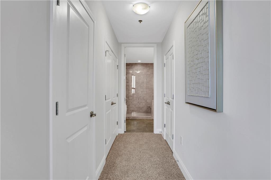 270 17th Street Northwest, Unit 3308 Atlanta, GA 30363 - Photo 25 of 49 a view of a hallway with wooden floor and closet