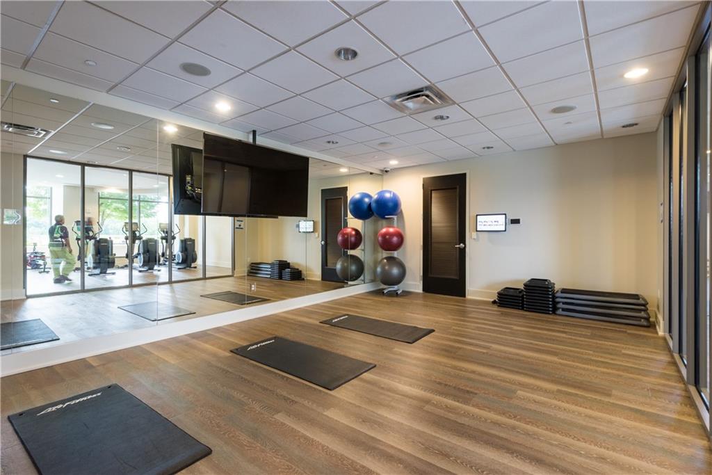 270 17th Street Northwest, Unit 3308 Atlanta, GA 30363 - Photo 45 of 49 a room with gym equipment and a large window