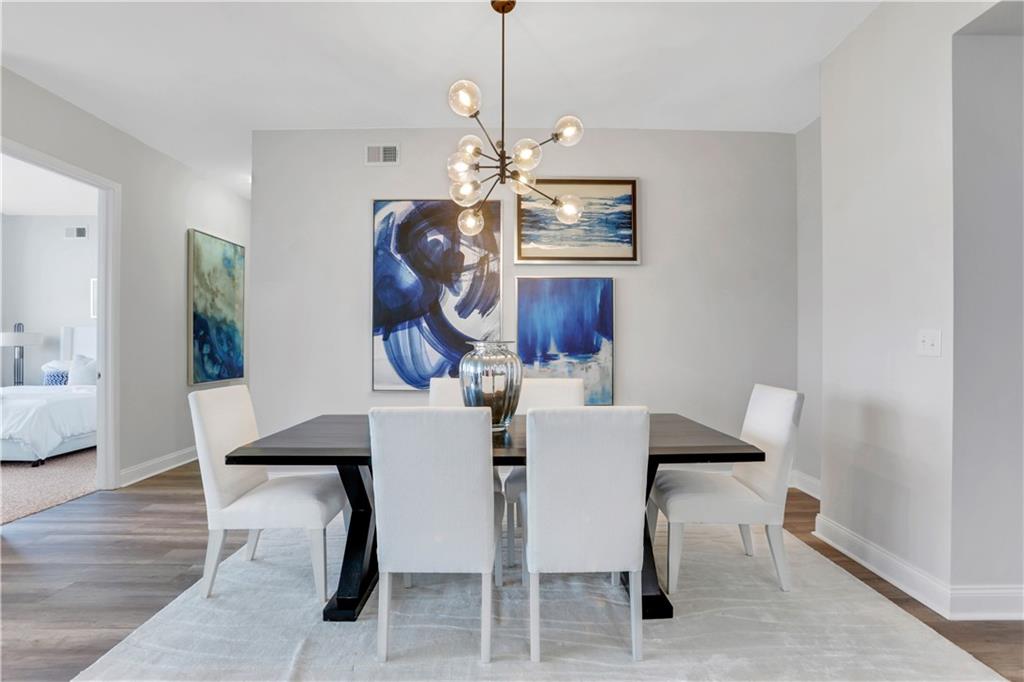 270 17th Street Northwest, Unit 3308 Atlanta, GA 30363 - Photo 9 of 49 a view of a dining room with furniture and wooden floor