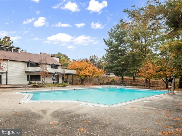 a view of a backyard with sitting area