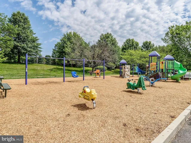 a swimming pool with outdoor seating and yard