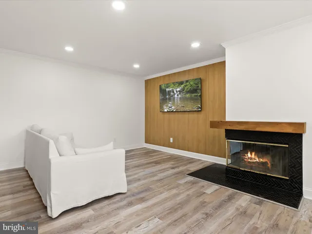 a view of an empty room with a fireplace