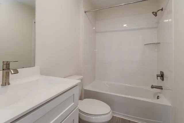 a bathroom with a sink a toilet and a bathtub